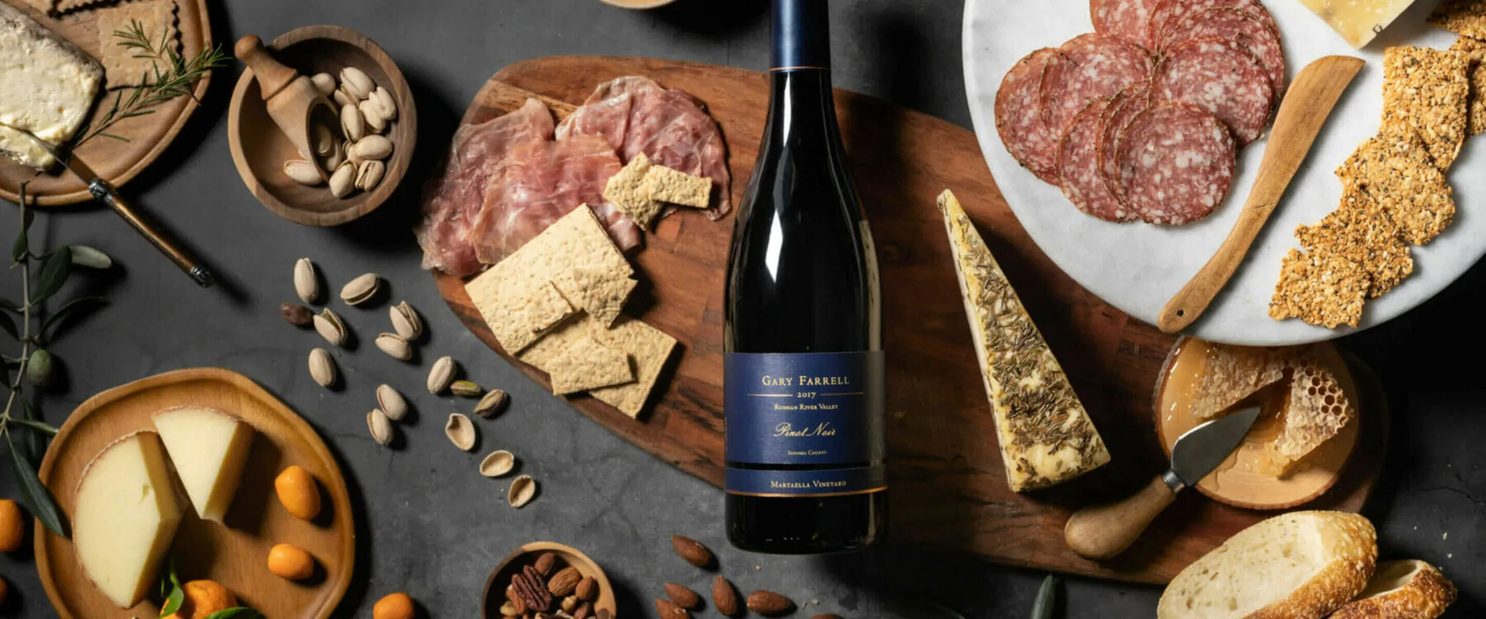 Bottle of Gary Farrell wine with cheese and charcuterie board