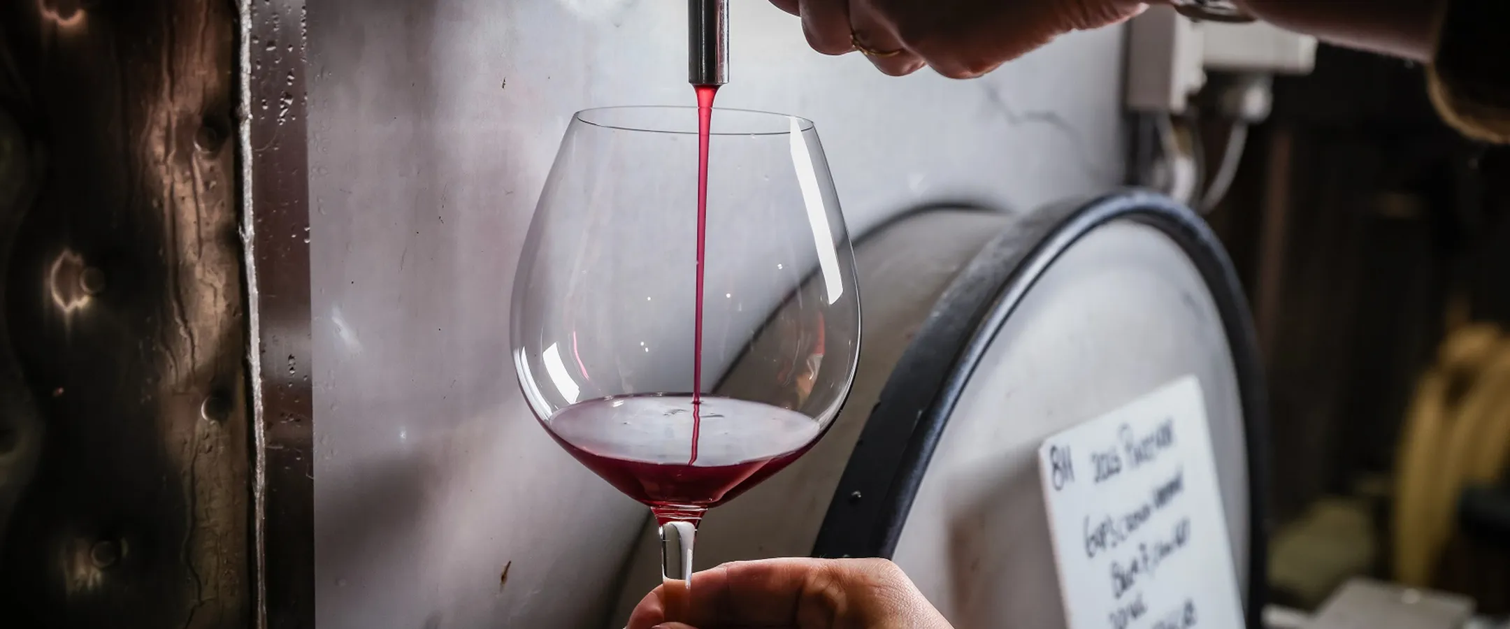 Red wine being pour into a glass