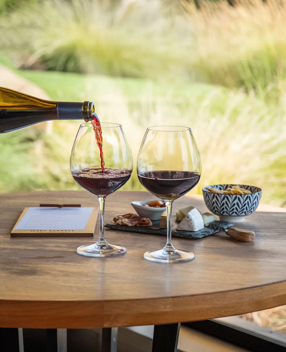 Two glasses of pinot noir on an outdoor table